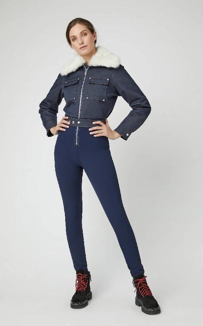 Shop Cordova Courchevel Shearling-trimmed Denim Jumpsuit In Blue