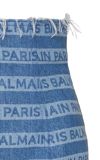 Shop Balmain Frayed Logo-printed Denim Skirt In Blue