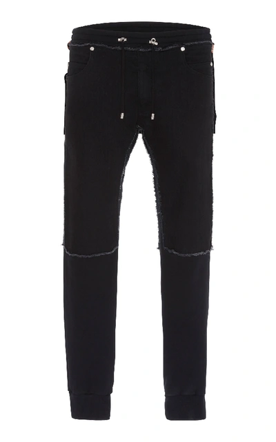 Shop Balmain Deconstructed Denim And Jersey Slim-leg Sweatpants In Black