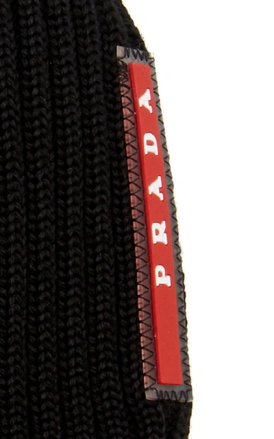 Shop Prada Logo-appliquéd Ribbed Wool Beanie In Black