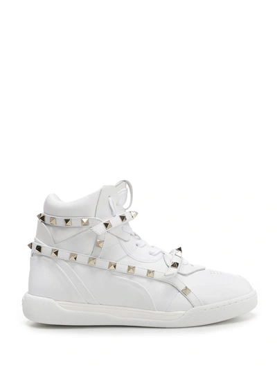 Shop Valentino Garavani Rockstud Armour Sneakers In White