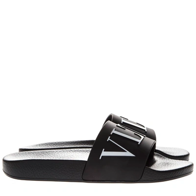 Shop Valentino Black Vltn Rubber Slide Sandal In Nero/bianco