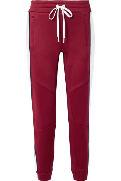 Shop All Access Prodigy Striped Stretch-jersey Track Pants In Burgundy