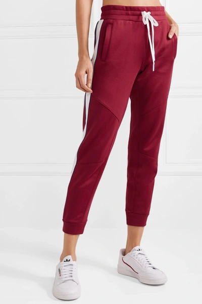 Shop All Access Prodigy Striped Stretch-jersey Track Pants In Burgundy
