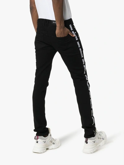 Shop Balmain Slim Leg Logo Stripe Biker Jeans In Black