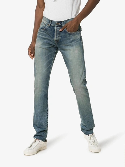 Shop Saint Laurent Bandana Raw-edge Jeans In 4378 Blue