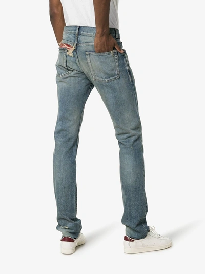 Shop Saint Laurent Bandana Raw-edge Jeans In 4378 Blue