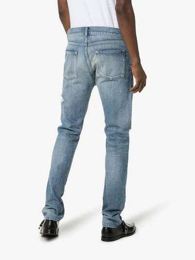Shop Saint Laurent Distressed Slim-fit Jeans In 4631 Blue