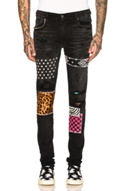 Shop Amiri Art Patch Jeans In Aged Black