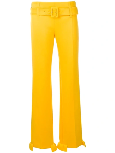 Shop Prada High-waisted Belted Ruffle Hem Trousers - Yellow