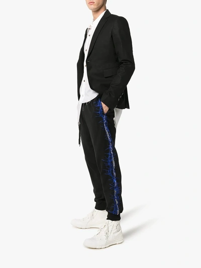 Shop Haider Ackermann Embroidered Sweatpants In 101 - Black