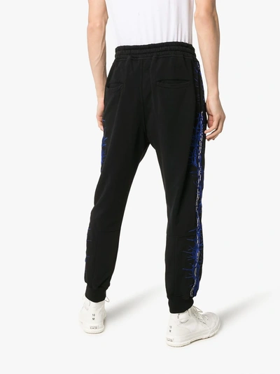 Shop Haider Ackermann Embroidered Sweatpants In 101 - Black