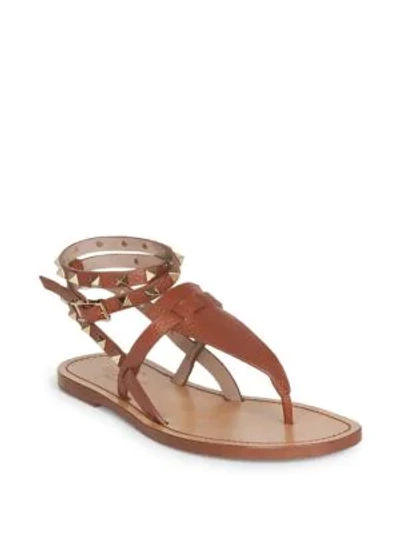 Shop Valentino Rockstud Double Pebbled Leather Wrap Thong Sandals In Tan