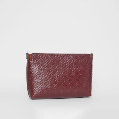 Shop Burberry Medium Monogram Leather Clutch In Oxblood