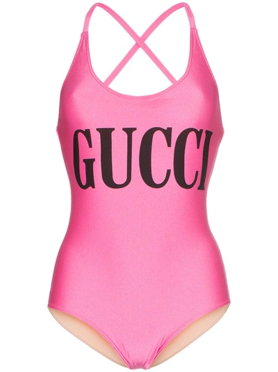Shop Gucci Logo Print Cross-over Strap Swimsuit - Pink