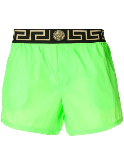 Shop Versace Greca Border Swim Shorts - Green