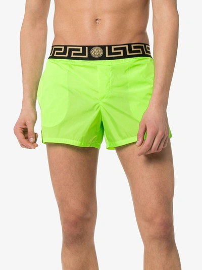 Shop Versace Logo Waist Swim Shorts In A86g Green