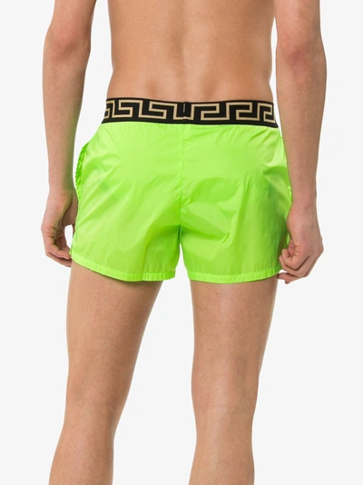 Shop Versace Logo Waist Swim Shorts In A86g Green