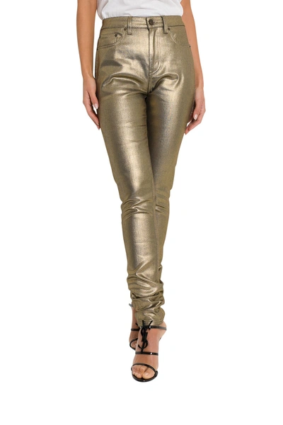 Shop Saint Laurent Gold-tone Laminated Jeans In Oro