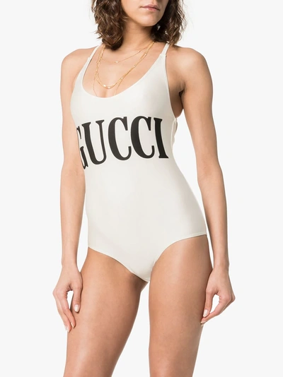 Shop Gucci Logo Print Racerback Swimsuit In Neutrals