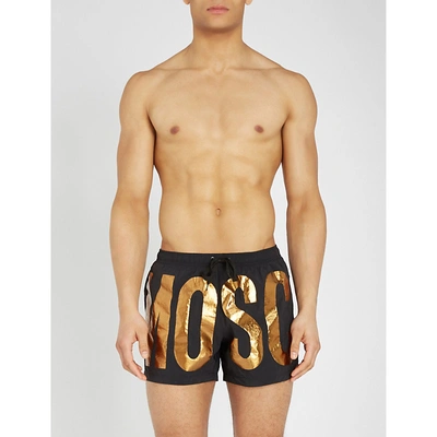 Shop Moschino Metallic Logo-print Relaxed-fit Swim Shorts In Bronze