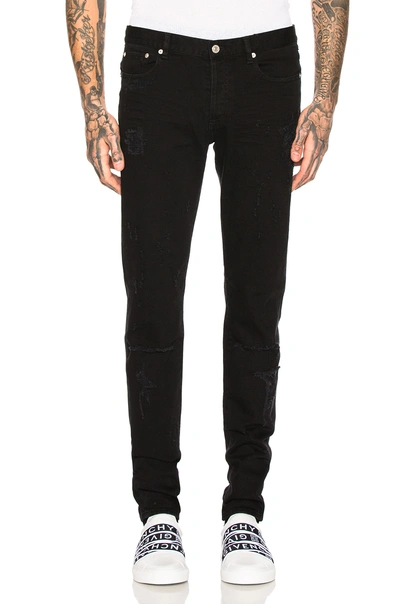 Shop Givenchy Distressed Jeans In Black