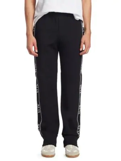 Shop Valentino Logo Trim Track Pants In Black