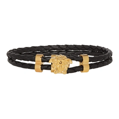Shop Versace Black And Gold Leather Medusa Wrap Bracelet In D41o Black/