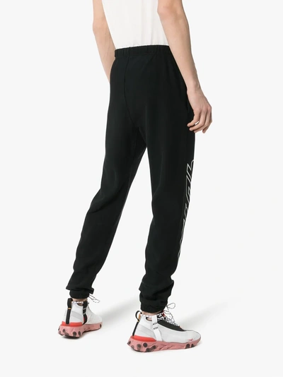 Shop Heron Preston Logo Printed Track Pants In Black