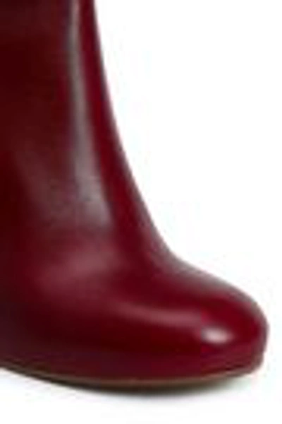 Shop Victoria Beckham Buckled Leather Wedge Knee Boots In Claret