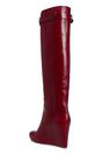 Shop Victoria Beckham Buckled Leather Wedge Knee Boots In Claret