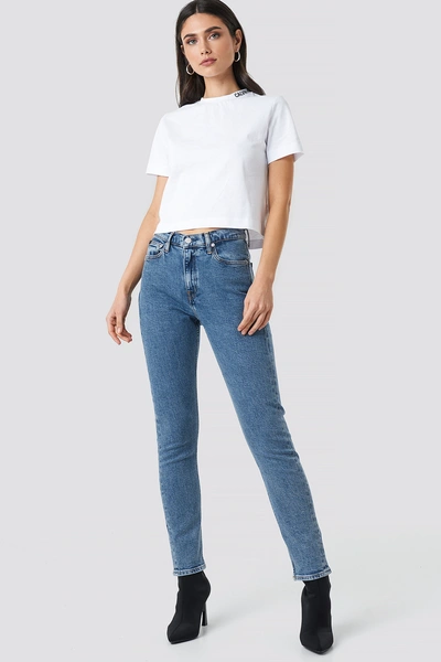 Shop Calvin Klein High Rise Slim Jeans Blue In Iconic Mid Stone