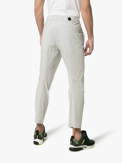 Shop Descente Allterrain White Wide Tapered Fit Long Pants In Neutrals