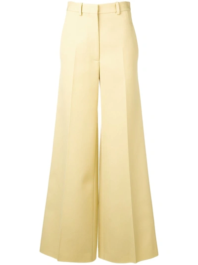 Shop Victoria Beckham Flared Tailored Trousers In Yellow