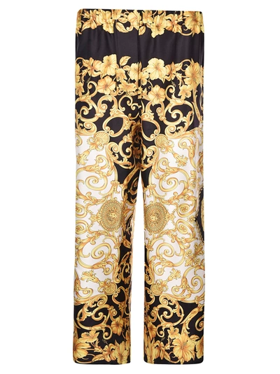 Shop Versace Floral Print Wide Trousers