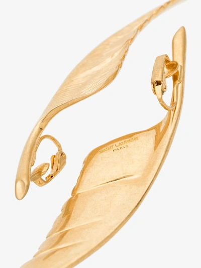 Shop Saint Laurent Metallic Curved Wing Earrings In Gold