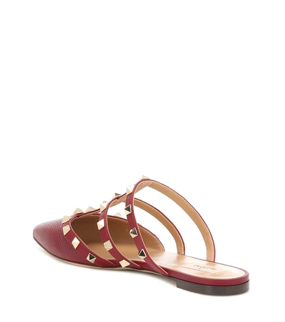 Shop Valentino Rockstud Leather Slippers In Red