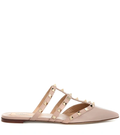 Shop Valentino Rockstud Patent Leather Slippers In Neutrals