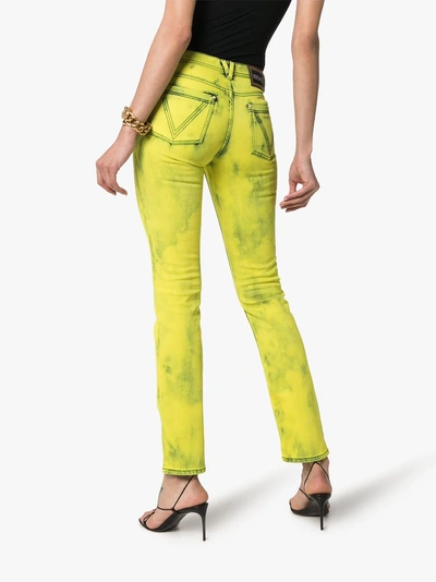 Shop Versace Acid Wash Logo Label Skinny Jeans In 115 - Yellow