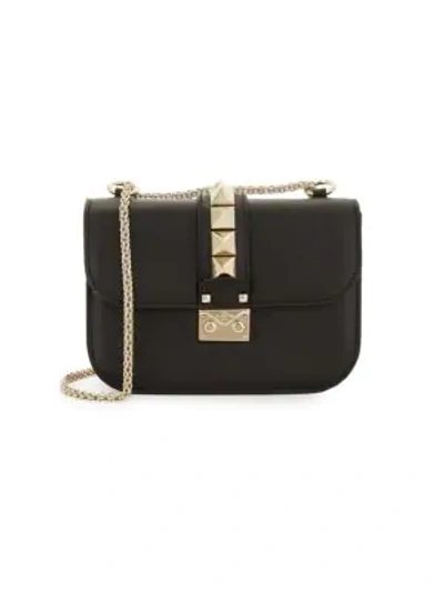 Shop Valentino Studded Leather Crossbody Bag In Black