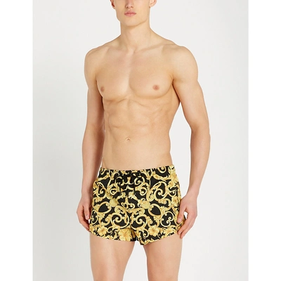 Shop Versace Hibiscus Baroque Swim Shorts In Black Gold