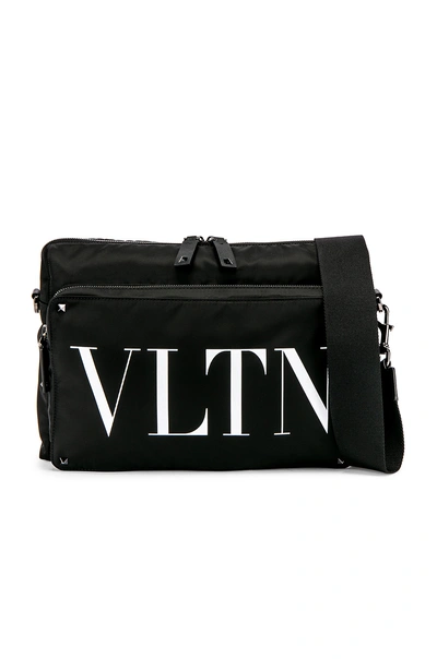 Shop Valentino Logo Messenger Bag In Black