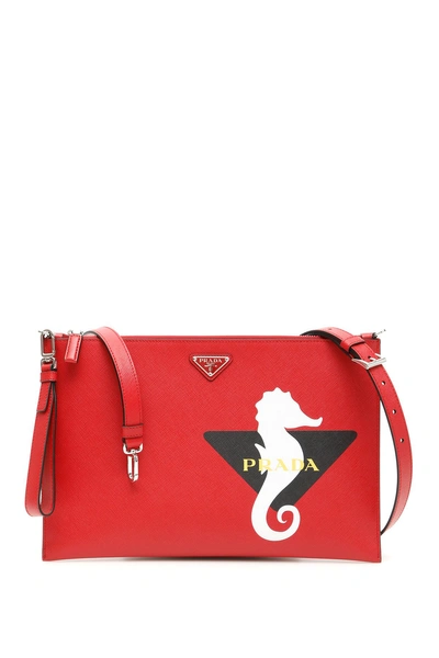 Shop Prada Seahorse Logo Clutch In Fuoco Bianco (red)