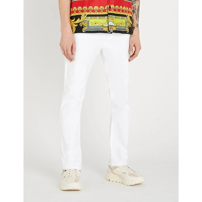 Shop Versace Regular-fit Straight-leg Jeans In White