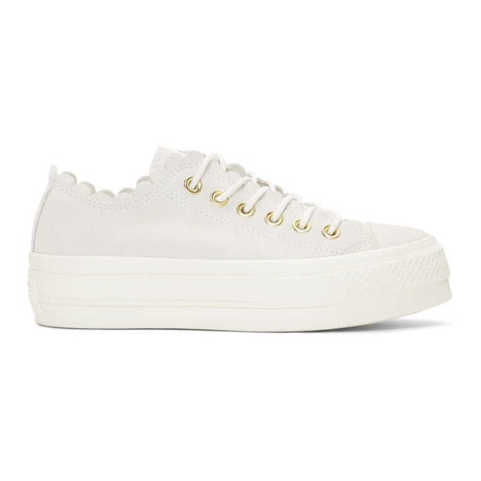 white frilly converse