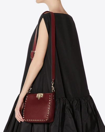 Shop Valentino Garavani Mini Rockstud Grainy Leather Hobo Bag In Cherry