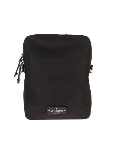 Shop Valentino Garavani Branded Crossbody Bag In Black