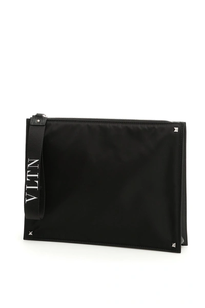 Shop Valentino Garavani Vltn Strap Clutch Bag In Black