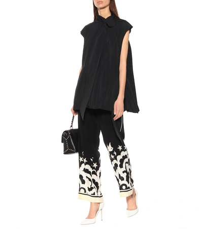 Shop Valentino Printed Silk Pants In Black