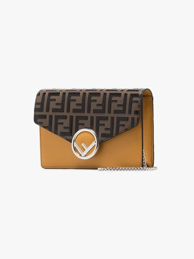 Shop Fendi Brown And Yellow Ff Logo Leather Clutch Bag In F15s7  Brown Yellow